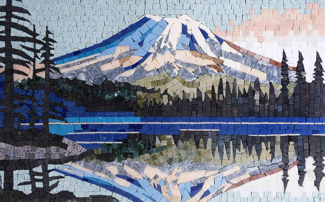 Mosaic landscape of a snow-capped mountain and dark conifers reflected in a still blue lake