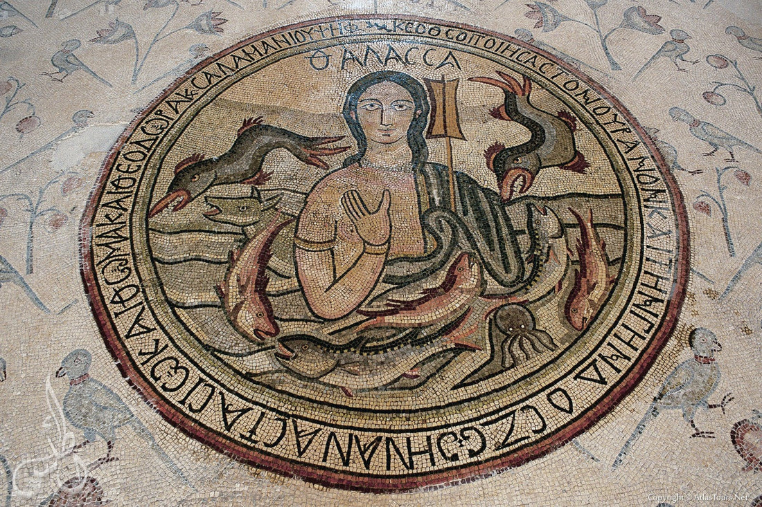 Ancient circular floor mosaic of a female sea figure ringed by Greek lettering and sea creatures