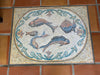 Tappeto a mosaico con pesci multipli