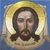 Visage de Jésus sur la mosaïque d'icônes avec halo de verre doré