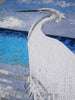 Aigrette blanche reflétant - Art de la mosaïque au bord de la mer
